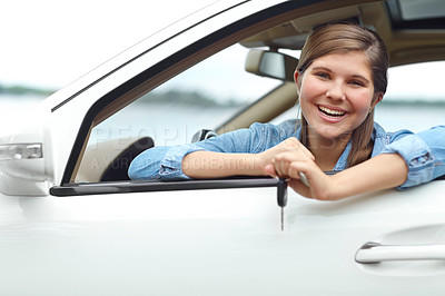 Buy stock photo Excited, portrait and teenager in car with keys for purchase, investment or vehicle gift on road. Driver, happy and girl from Canada by window for transport, commute or motor ownership with present.