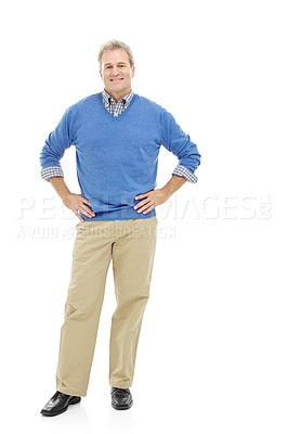 Buy stock photo Studio portrait of a mature, attractive male standing casually with his hands on his hips