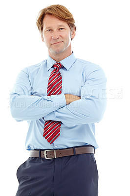 Buy stock photo Studio portrait of a confident mature businessman standing with his arms crossed isolated on white