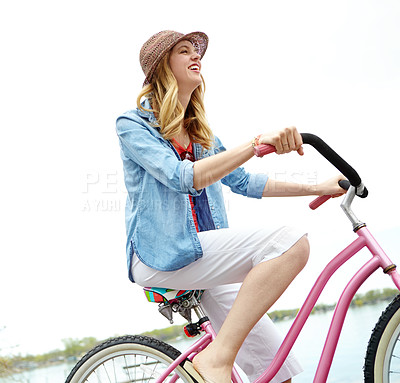 Buy stock photo Active, riding and woman with bicycle, travel and eco friendly with reduced emissions and weekend. Commuting, happy and person with transport, smile and cycling in morning, energy and fun with bike