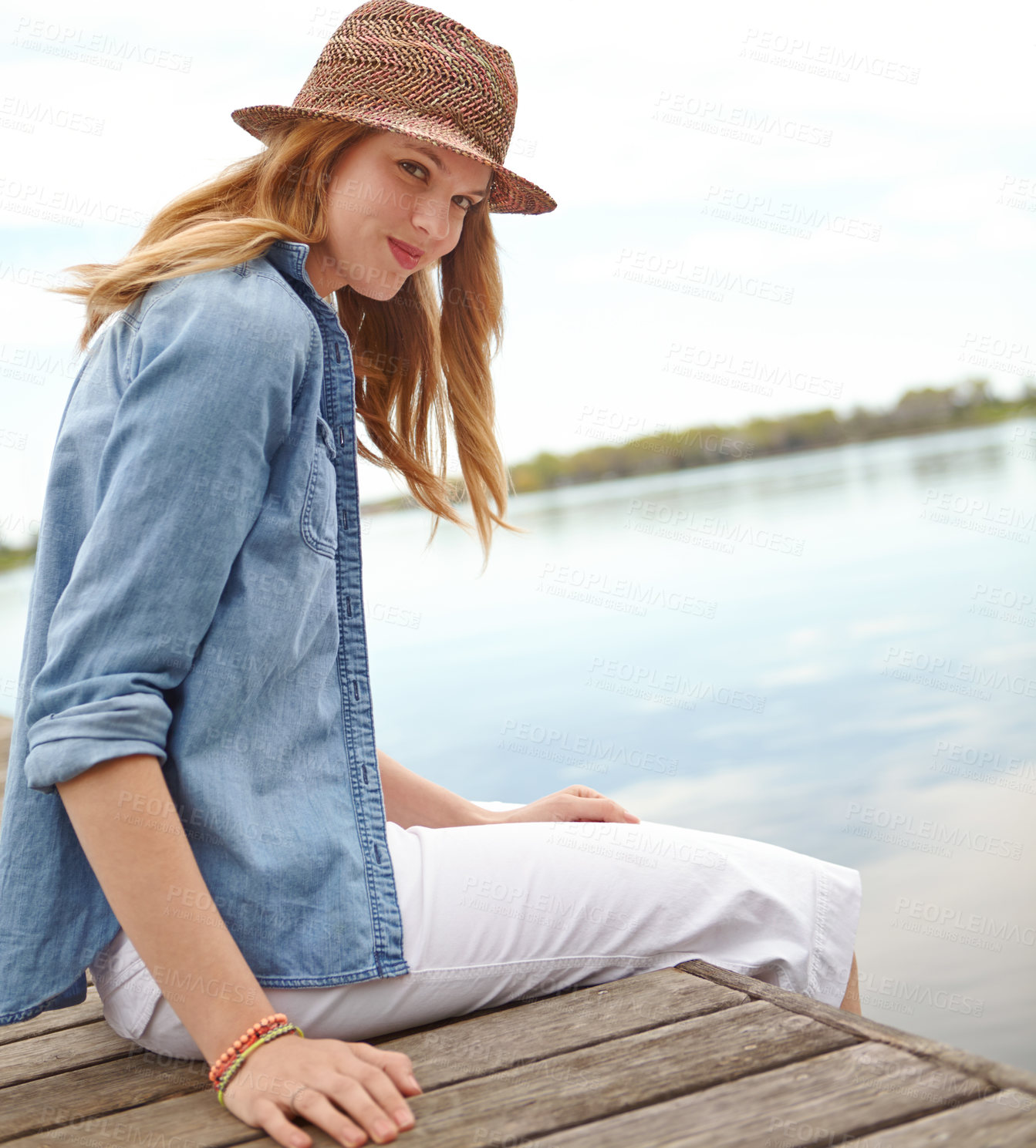 Buy stock photo Portrait, woman and jetty for holiday, travel or vacation with happiness, sky and relax on lake. Female person, smile and freedom on pier for ideas, outdoor adventure or peace as tourist in Indonesia