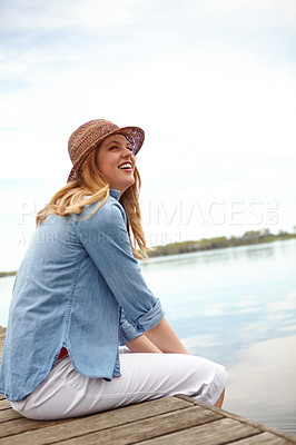 Buy stock photo Thinking, girl and jetty for holiday, travel and vacation with happiness, sky and relax on lake. Female person, smile and freedom on pier for ideas, outdoor adventure or peace as tourist in Indonesia