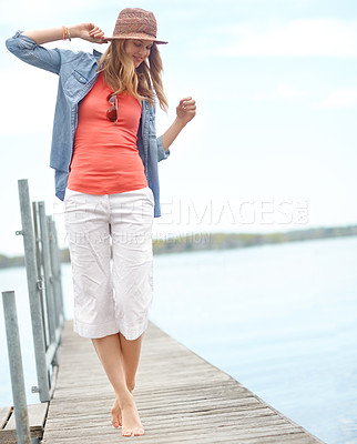 Buy stock photo Holiday, fashion and woman on pier with fun, relax and outdoor adventure in nature. Dock, lake and girl with smile on travel vacation with casual style, confidence and calm weekend morning in Canada