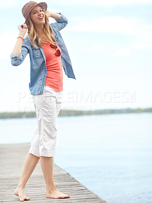 Buy stock photo Holiday, fashion and portrait of girl on pier with smile, relax and outdoor adventure in nature. Dock, lake and happy woman on travel vacation with casual style, confidence and calm morning in Canada