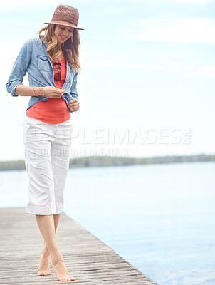 Buy stock photo Holiday, relax and woman on pier with fashion, smile and outdoor adventure in nature. Dock, lake and happy girl on travel vacation with casual style, confidence and calm weekend morning in Canada