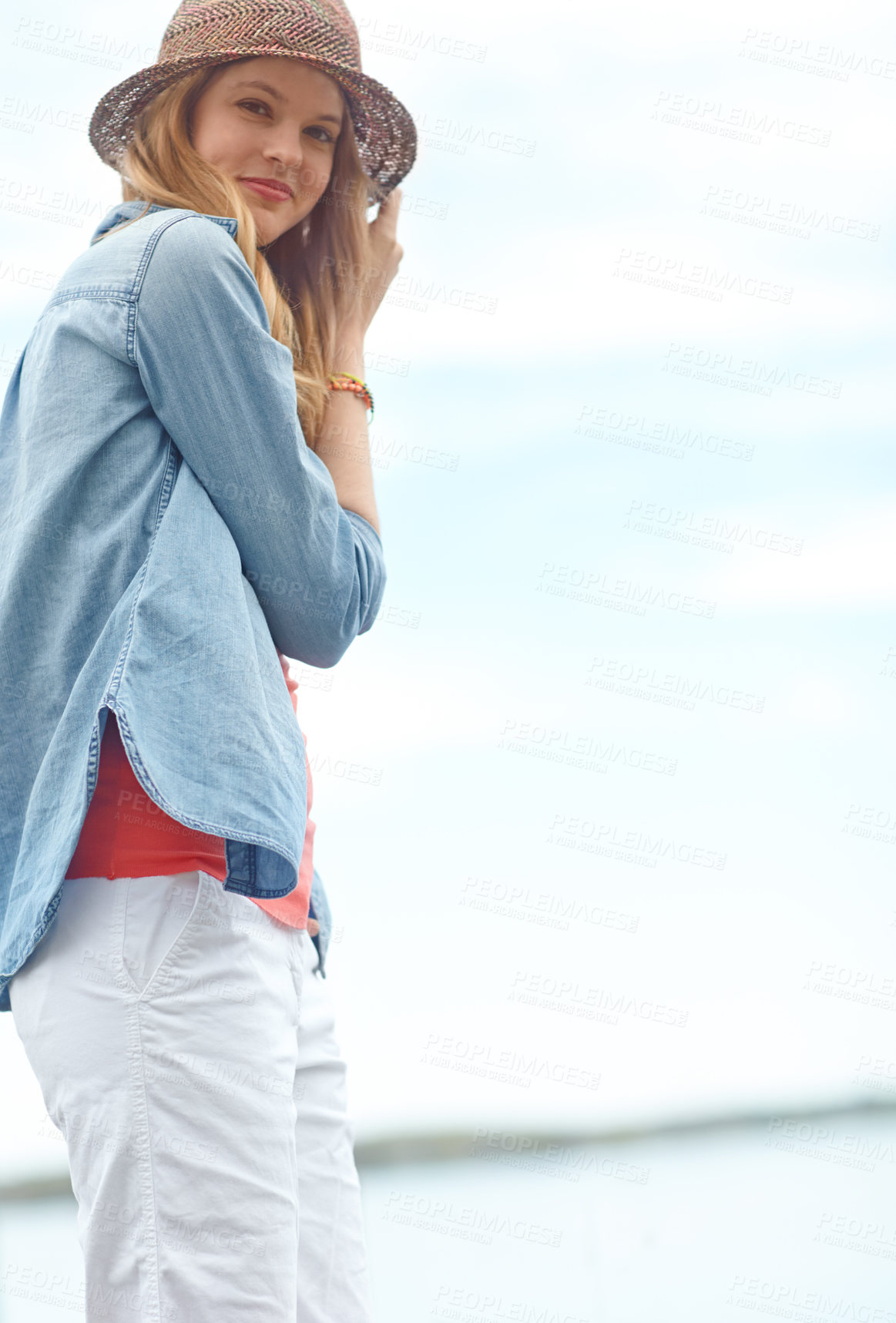 Buy stock photo Holiday, fashion and portrait of woman at lake with smile, relax and outdoor adventure in nature. Pier, river and happy girl on travel vacation with casual style, confidence or calm morning in Canada