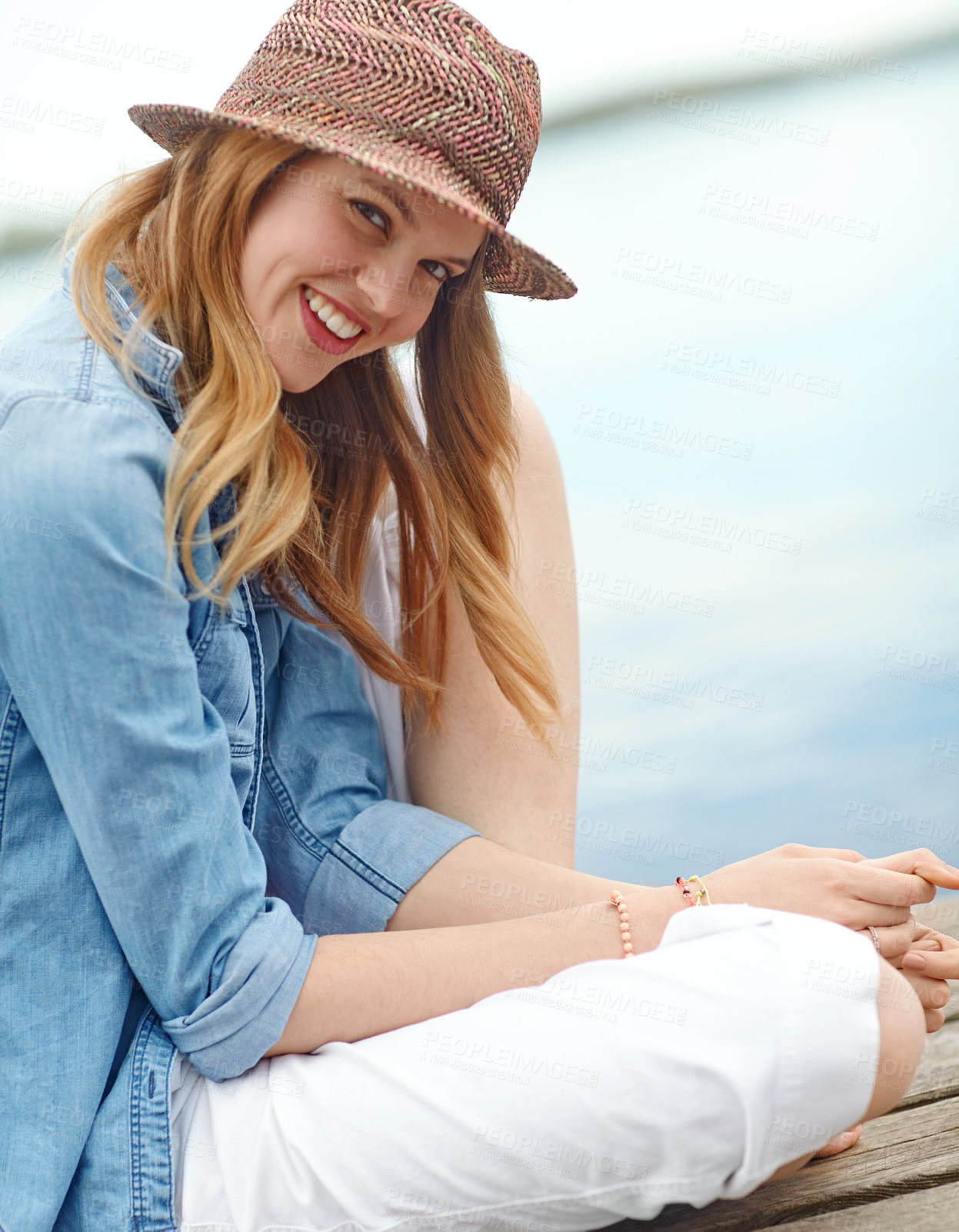 Buy stock photo Woman, lake and smile with view, portrait and relax for holiday, vacation or happy on travel journey. Girl, tourist and dock with calm in nature, environment or sightseeing by water in Denmark