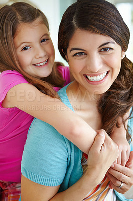 Buy stock photo Happy mother, portrait and piggyback child in family home for love, care and bonding together. Face, mom and hug girl for support, connection and trust single parent with foster daughter in Finland