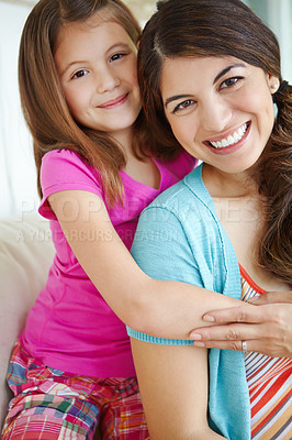 Buy stock photo Happy mother, portrait and hug child in family home for love, care and bonding together. Face, mom and embrace girl for support, connection and trust single parent with foster daughter in New Zealand