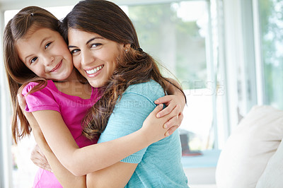 Buy stock photo Happy mother, portrait and hug kid in family home for love, care or bonding together to relax. Face, mom or embrace girl for support, connection or trust single parent with foster daughter in Germany