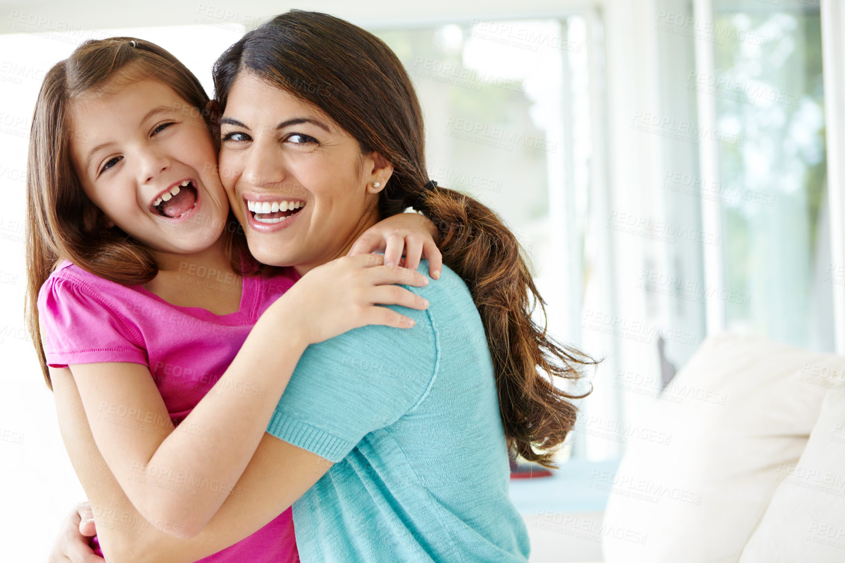 Buy stock photo Laughing mom, portrait and hug child in family home for love, care and funny joke Face, mother and embrace girl for support, connection and safety of daughter with single parent together in Finland