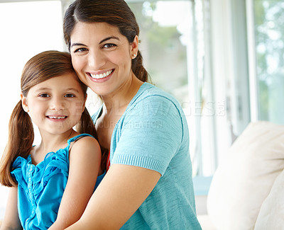 Buy stock photo Happy mom, portrait and kid in family home for love, care and bonding together. Face, mama and girl child on sofa for support, connection and single parent with daughter on mothers day in Sweden