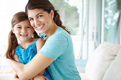 Buy stock photo Happy mother, portrait and hug with daughter on sofa for bonding, motherhood or love at home. Mom, child or little girl with smile for childhood, embrace or holiday weekend together on couch at house