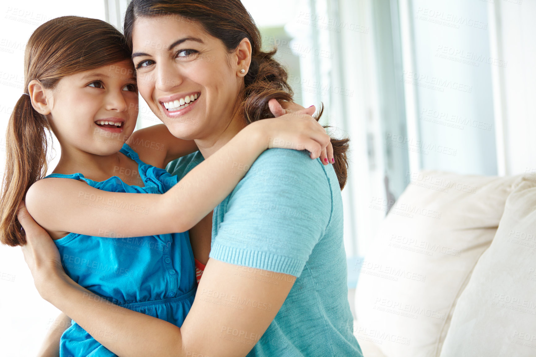 Buy stock photo Mother, child and portrait with hug on sofa in home for bonding, affection and security with smile. Happy family, woman and girl kid with embrace on couch for connection, love and care in apartment