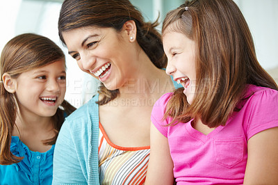 Buy stock photo Happy, children and laughing with mother in home for support, development and connection on weekend. Family fun, care and girl kids with smile by woman in house for love, bonding or relaxing together