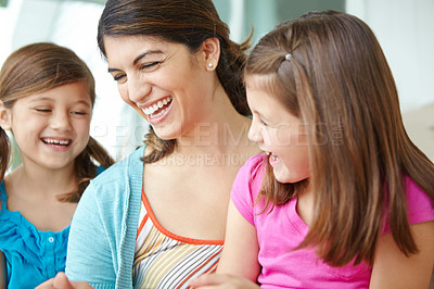 Buy stock photo Happy, kids and laughing with mother in home for support, development and connection on weekend. Family fun, care and girl children with smile by woman in house for love, relaxing or bonding together