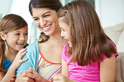 Buy stock photo Happy, kids and playing with mother in home for development, support and connection on weekend. Family fun, love and girl children with smile by woman in house for care, relaxing or bonding together