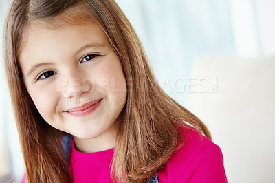 Buy stock photo Girl, happy and portrait of child on sofa for fun on weekend in living room of house or home. Smile, satisfaction and face of female kid alone on couch for happiness, comfort and childhood in Spain