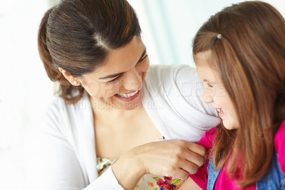 Buy stock photo Laughing, mom and love for child, tickling and bonding with daughter, calm and happy with girl or family. Smile, mother and care for kid, relax and motherhood for woman, adoption  or together in home