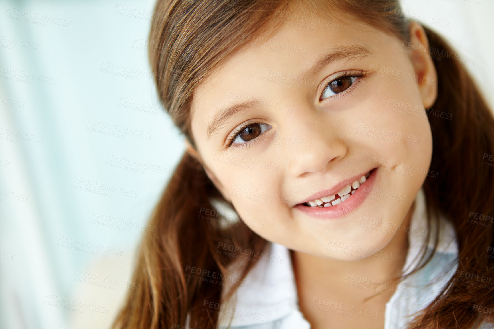 Buy stock photo Girl, confident or portrait of child in home for joy and fun on weekend in living room of house. Smile, growth or face of healthy female kid alone for happiness, satisfaction or childhood in Spain