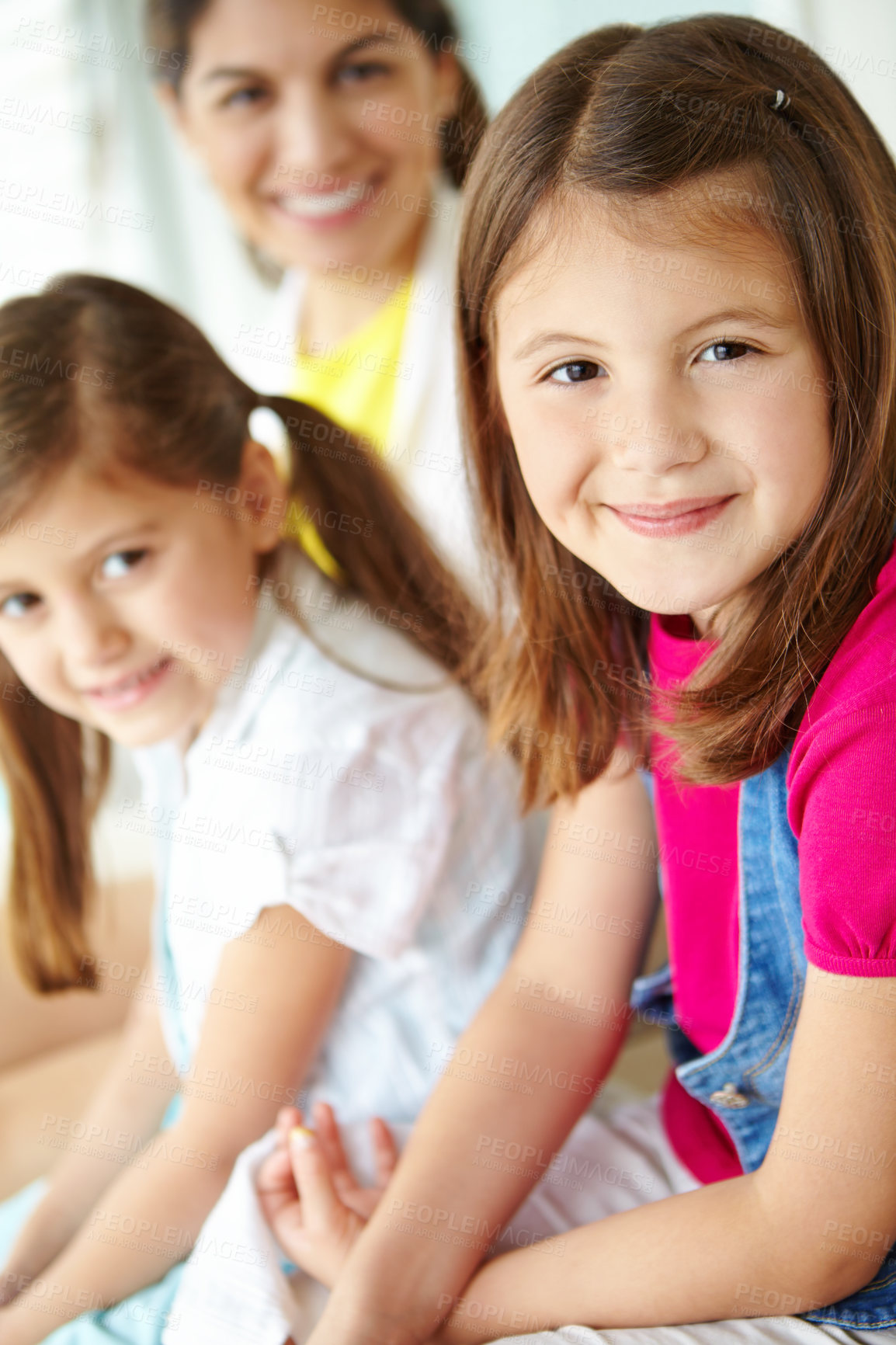 Buy stock photo Family, mom or portrait of girl in home for fun or development in living room of house. Relax, sisters or face of confident kid in Spain bonding with parent blur for happiness, comfort or siblings