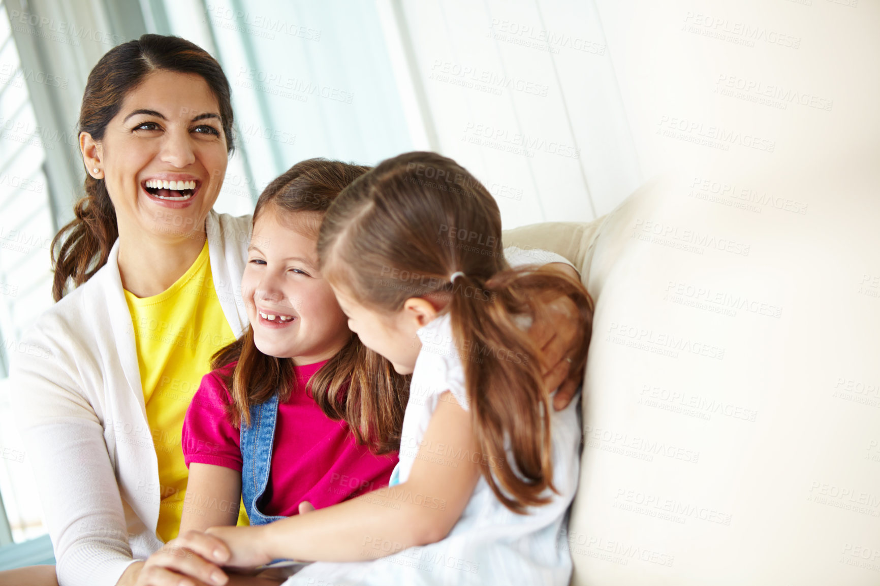 Buy stock photo Mother, children and happy in home for relax, bonding and weekend fun with hug on sofa. Woman, kids and laughing in living room for relationship development, family time and tickle game in apartment