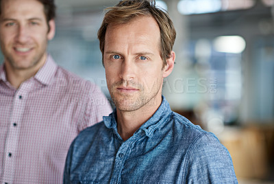 Buy stock photo Portrait of a mature serious man with a coworker in the background