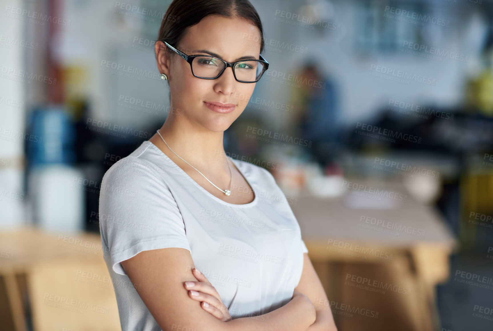 Buy stock photo Portrait, confident and creative business woman in office for career, job and startup company. Face, glasses and professional entrepreneur with arms crossed, copywriter or employee working in Spain