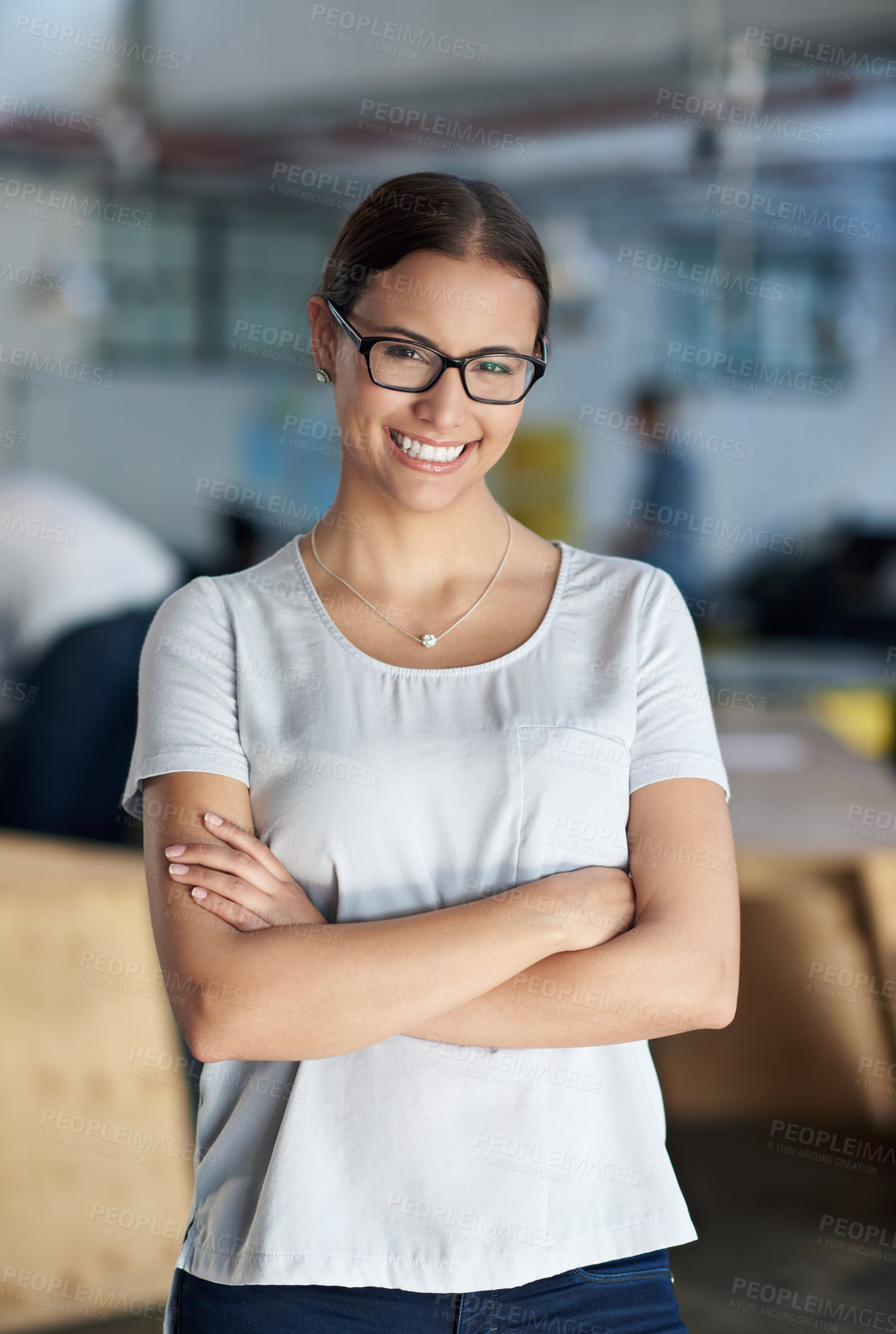 Buy stock photo Portrait, smile and business woman with arms crossed in office for creative career, job or startup company. Face, glasses and confident professional entrepreneur, copywriter or employee work in Spain