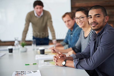 Buy stock photo Portrait of a group of coworkers sitting at a conference table