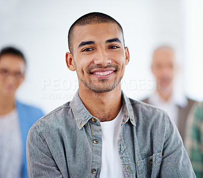 Buy stock photo Proud looking young man with people in the background
