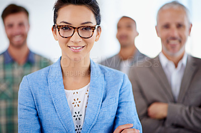 Buy stock photo Closeup portrait of a young businesswoman and male colleagues in the background