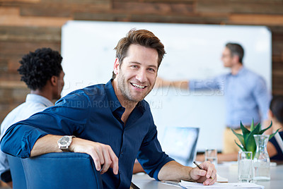 Buy stock photo Portrait of a handsome creative professional smiling at the camera in a modern conference room