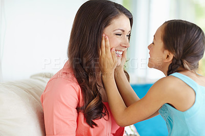 Buy stock photo Smile, relax and mother with kid on sofa for bonding, security and connection at family home. Love, happy and girl sitting on lap of mom for childhood advice, conversation or lesson in living room.