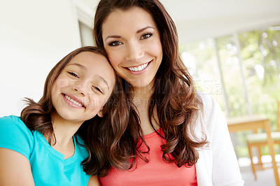 Buy stock photo Girl, mother and happy in home with portrait for mom and daughter bonding on weekend with childhood love. Parent, kid and smile together in house with embrace or affection, care and relax with joy.