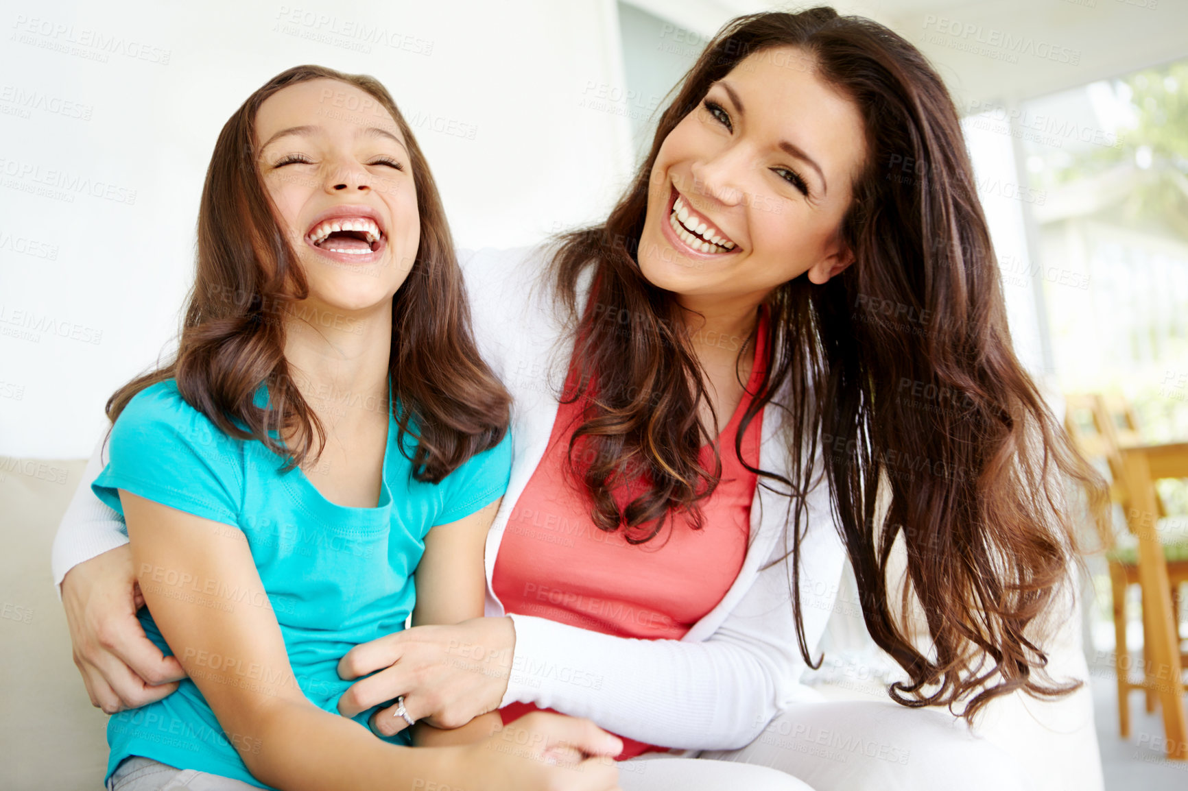 Buy stock photo Girl, mom and playing on sofa with laugh for mother and daughter bonding on weekend with childhood fun. Parent, kid and happy together in house with love or affection, care and tickle game on couch.