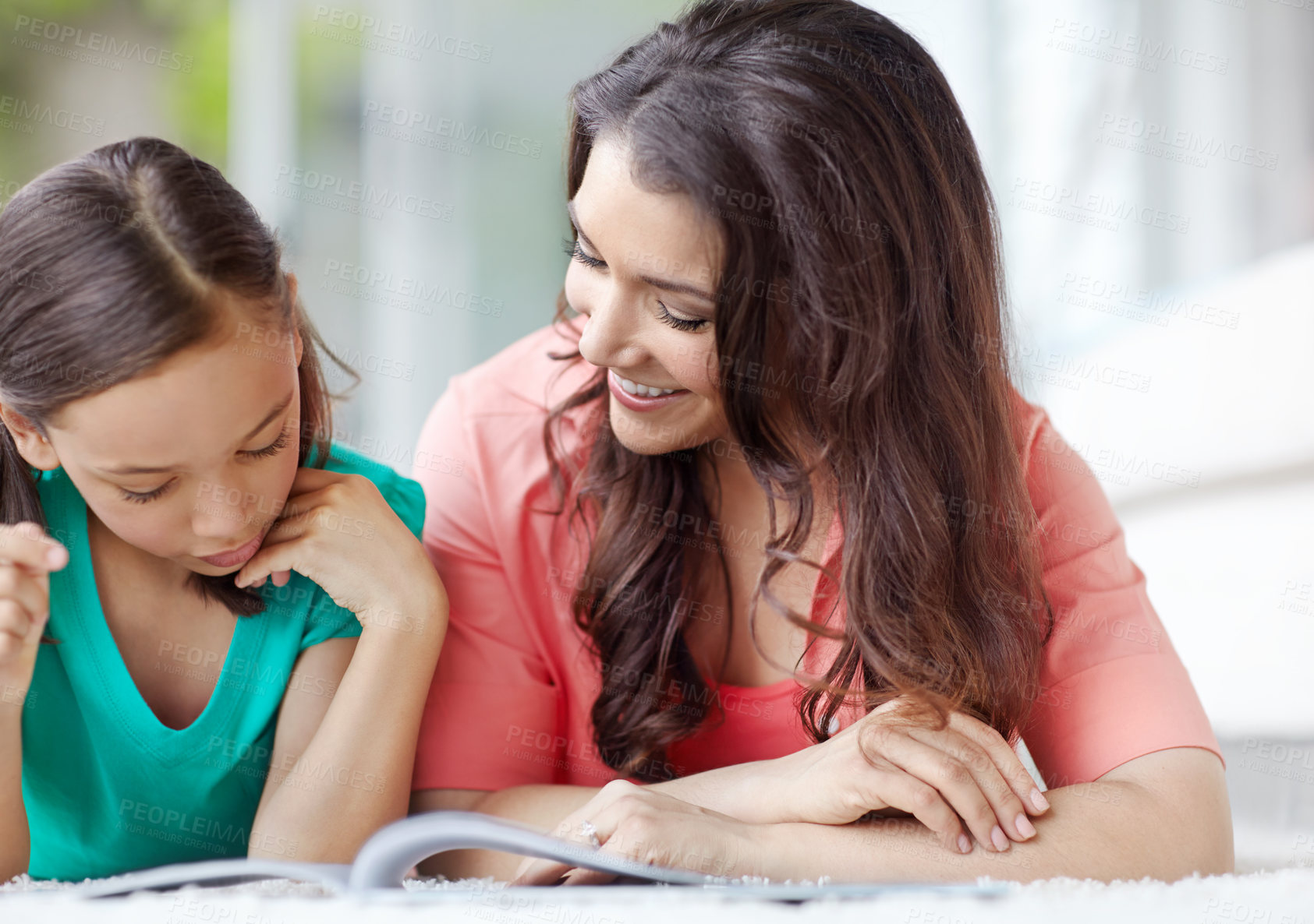 Buy stock photo Reading, mom and daughter with book, home and bonding with education, growth and development of child. Learning, woman and helping girl with studying, family and love in house, mother and kid