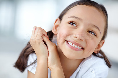 Buy stock photo A cute girl with pigtails smiling and looking up