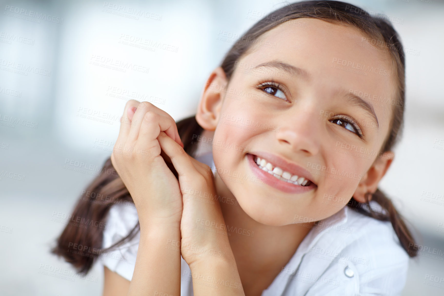 Buy stock photo Face, smile and thinking with girl in home for daydreaming, fantasy or childhood hope. Future, idea and imagine with happy kid in apartment for child development for growth or vision of growing up