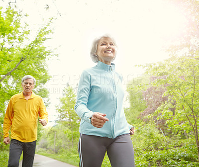 Buy stock photo Senior couple, smile and outdoor for exercise, wellness and jog in nature with bonding together. Elderly people, below and fitness in retirement for health, workout or training as pensioner in park