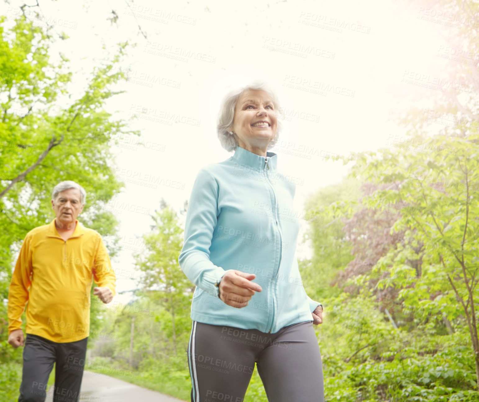 Buy stock photo Senior couple, smile and outdoor for exercise, wellness and jog in nature with bonding together. Elderly people, below and fitness in retirement for health, workout or training as pensioner in park