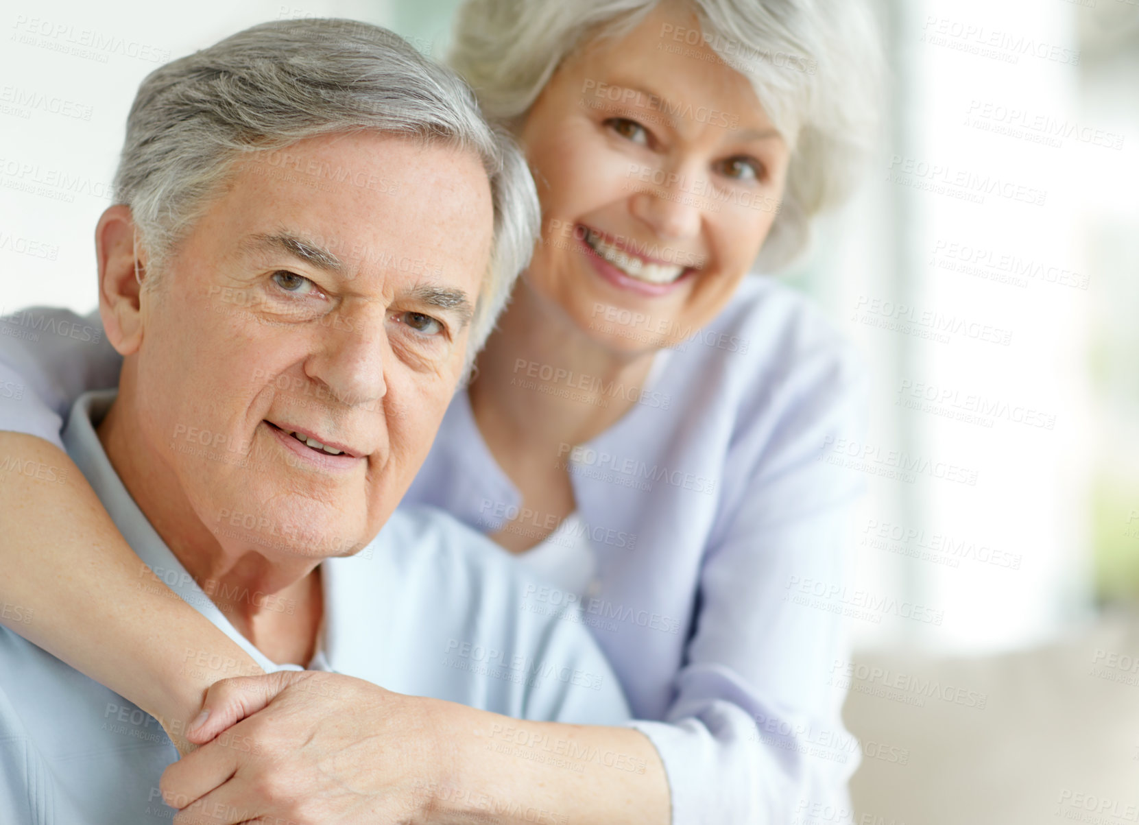 Buy stock photo Bonding, hug and portrait of senior couple on sofa in living room of home together for commitment or love. Face, smile or trust with old man and woman embracing in apartment for retirement or safety