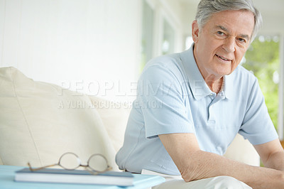 Buy stock photo Elderly man, portrait and relax in home on sofa for retirement, good health and weekend with break. Senior male, smile and healthy person on pension for positive mood, comfort and peace on couch