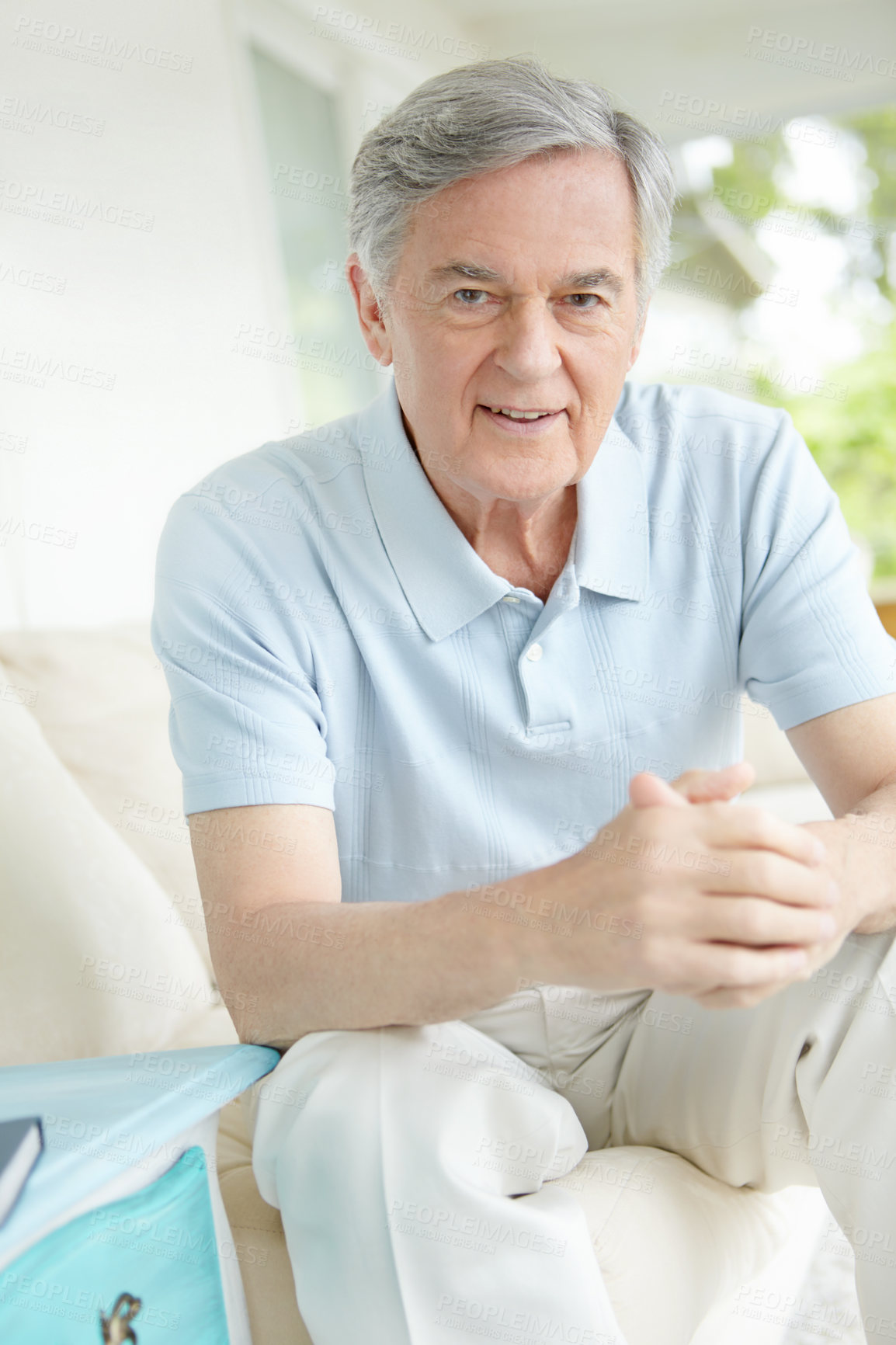 Buy stock photo Portrait, retirement and smile with senior man on sofa in living room of home for comfort or rest. Happy, relax and wellness with face of confident mature person in apartment for weekend time off