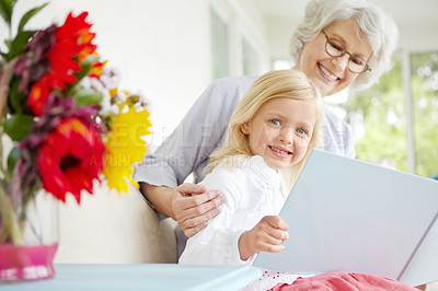 Buy stock photo Grandmother, smile and girl reading book in home for learning, bonding and knowledge together. Grandma, senior woman and kid storytelling in family house for fairytale, fantasy or child development