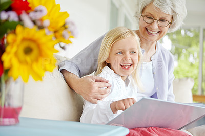 Buy stock photo Grandma, happy and girl reading book in home for learning, bonding and knowledge together. Grandmother, senior woman and kid in family house thinking of fairytale, fantasy story or child development