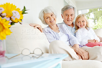 Buy stock photo Elderly man, woman and child in portrait with grandparents, happiness and bonding in family home. Senior people, girl and together for care in living room, house or lounge for growth, support or love