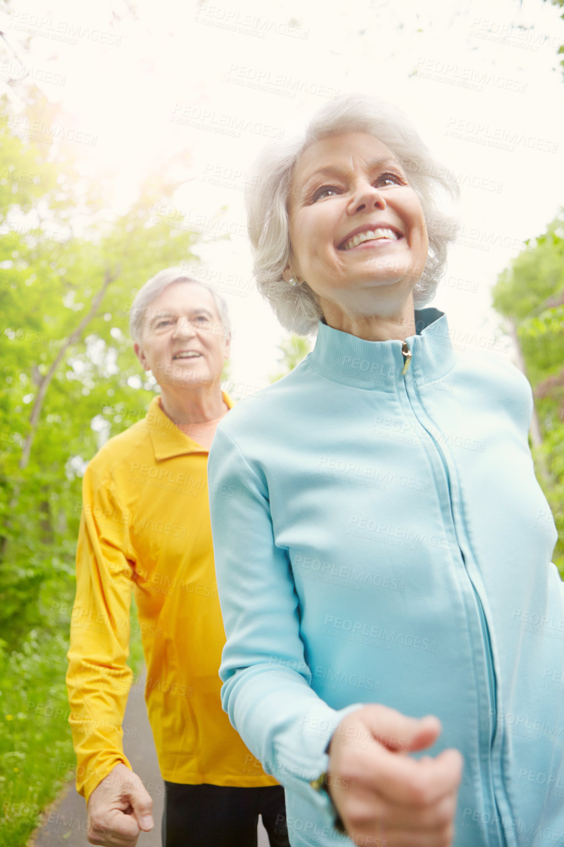 Buy stock photo Senior couple, smile and outdoor for walking, wellness and training in nature or bonding together. Elderly people, happy and exercise in retirement for health, workout or fitness as pensioner in park