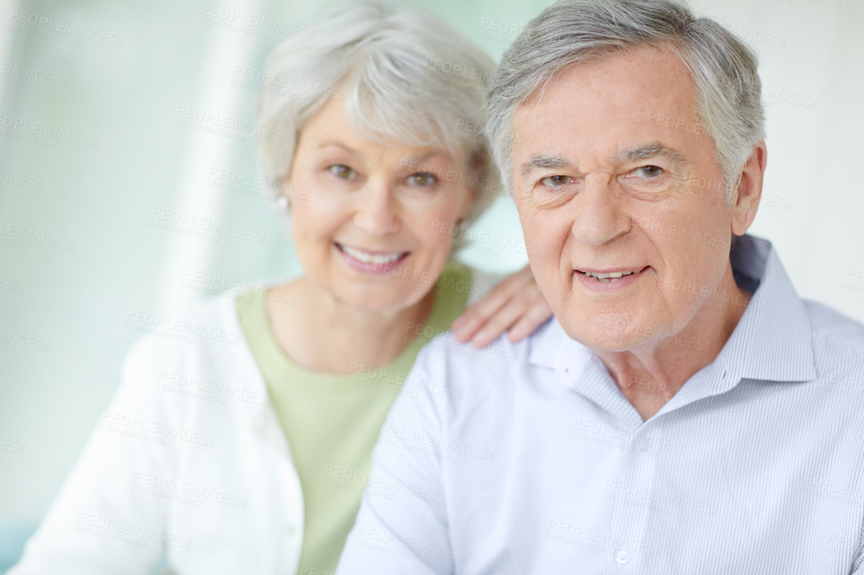 Buy stock photo Portrait, smile and senior couple in home with love for romantic connection on weekend together. Elderly man, woman and relax with happiness in house for retirement support, joy and marriage bonding