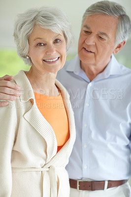 Buy stock photo Senior couple, smile and portrait with hug in home for bonding, retirement and romantic connection. Elderly woman, man and face with happiness in house for peace, marriage or love on weekend together